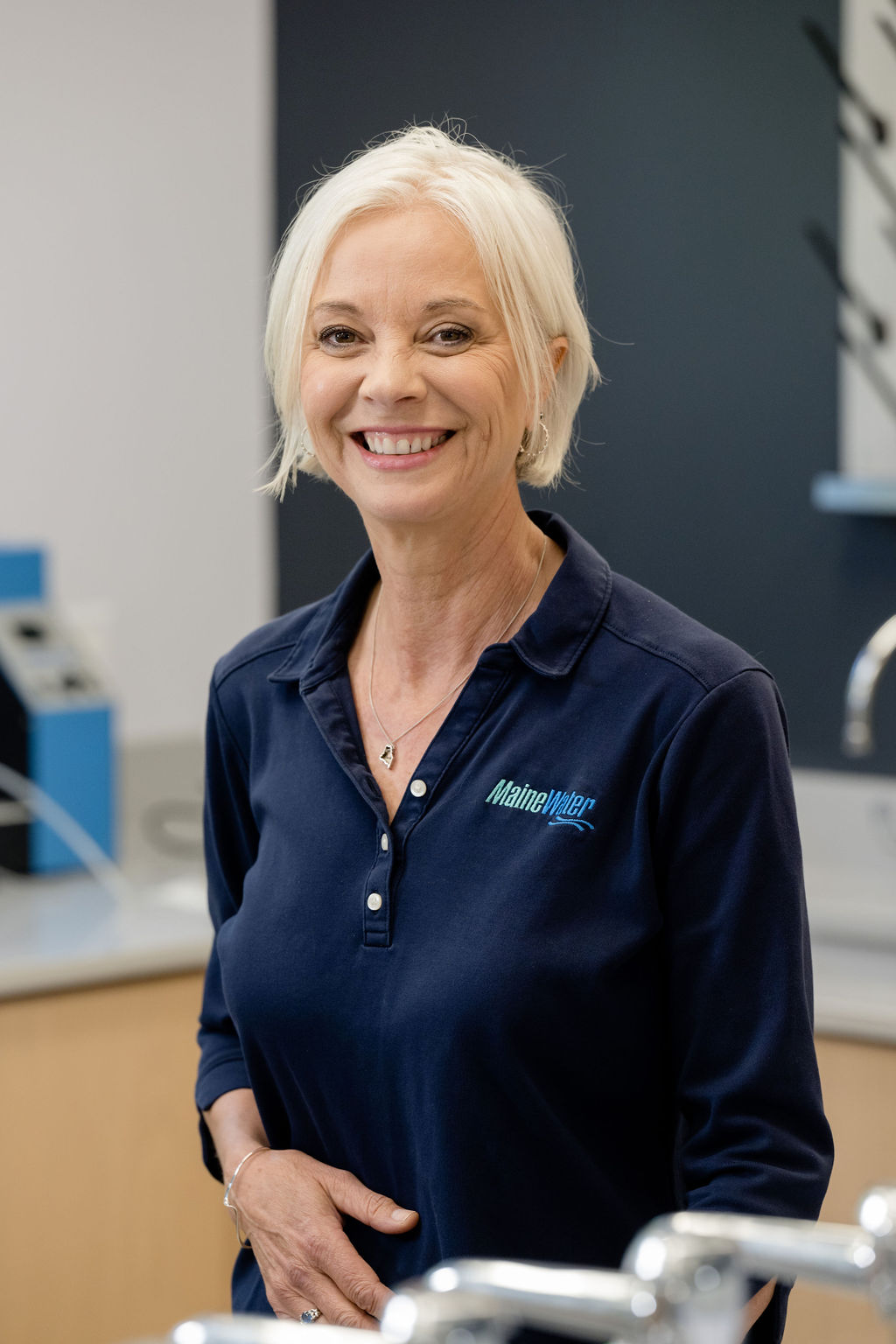 Maine Water employee looking at the camera and smiling