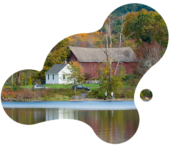 image of a lake with a red barn in the background